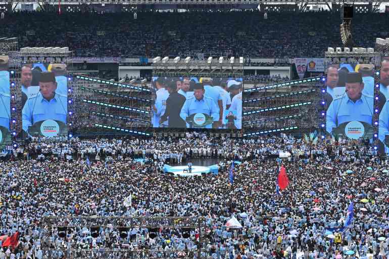 Presidential candidate Prabowo Subianto (C) delivers a speech during a campaign rally in Jakarta on February 10, 2024. (Photo by ADEK BERRY / AFP)