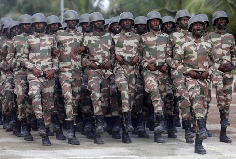 Somali military officers march in a parade during celebrations to mark the 62nd anniversary of the Somali National Armed Forces in Mogadishu, Somalia April 12, 2022. REUTERS/Feisal Omar