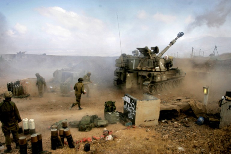 An Israeli army 155 mm mobile artillery piece fires into southern Lebanon from a position on the frontier in Zaura July 13, 2006. Israel struck Beirut airport and Hizbollah's television station on Thursday and killed 22 civilians in raids on south Lebanon, intensifying its reprisals after Hizbollah captured two Israeli soldiers and killed eight. REUTERS/Yonathan Weitzman (ISRAEL)