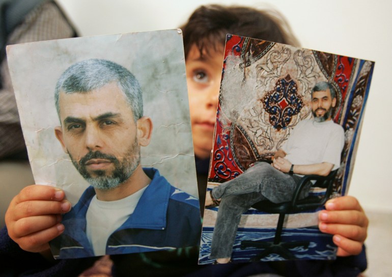 A relative of Yehya al-Sinwar, a top Hamas armed commander whose name was among other name of Palestinian faction leaders Hamas wants freed within a possible prisoner swap with Israel, poses with his picture at his home in the southern Gaza strip April 8, 2007. Hamas has handed over the names of Palestinian prisoners it demands Israel release in exchange for an Israeli soldier seized by Gaza gunmen 10 months ago, the Islamist group said on Sunday. REUTERS/Mohammed Salem (GAZA)