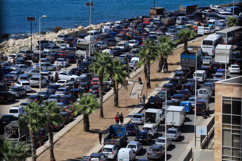 Cars sit in traffic as people flee the southern villages amid ongoing Israeli airstrikes, in Sidon, Lebanon, Monday, Sept. 23, 2024. (AP Photo/Mohammed Zaatari)