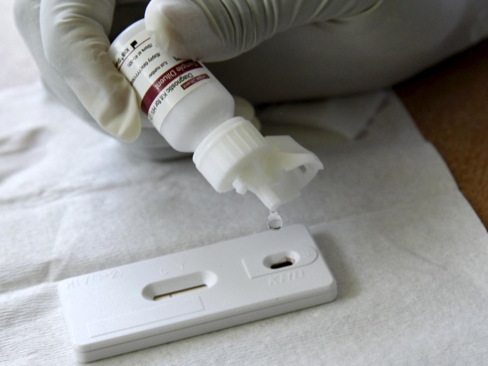 Margaret Muchiri, a counsellor, adds a reactor to a blood sample from a woman to test for HIV at the Mater Hospital in Kenya's capital Nairobi, September 10, 2015. Most of the 3,000 patients at Mater Hospital's Comprehensive Care Clinic, dedicated to HIV/AIDS treatment, come from nearby shanty towns. In Kenya, HIV prevalence among adults has almost halved since the mid-1990s to 5.3 percent in 2014, according to UNAIDS. Yet HIV/AIDS remains the leading cause of death in Kenya, responsible for nearly three in 10 deaths in the east African country, where 1.6 million Kenyans are infected, government data in 2014 shows. Picture taken September 10, 2015. To match Special Series DEVELOPMENT-GOALS/KENYA-HEALTH REUTERS/Thomas Mukoya