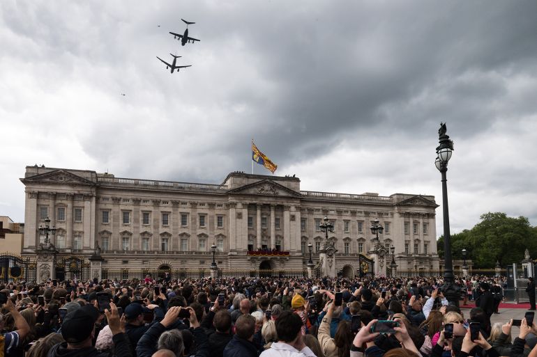 LONDON, UNITED KINGDOM - MAY 05, 2025: Crowds gather outside Buckingham Palace to watch a fly-past by the Royal Air Force Voyager and A400M Atlas during 80th anniversary of VE Day celebrations in London, United Kingdom on May 05, 2025. Victory in Europe Day is the day celebrating Germany's unconditional surrender of its armed forces on Tuesday, 8 May 1945 towards the end of World War II. (Photo credit should read Wiktor Szymanowicz/Future Publishing via Getty Images)