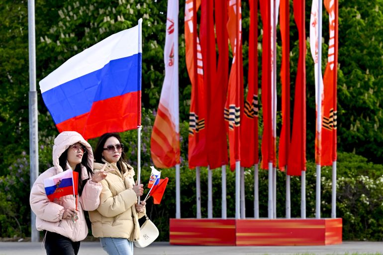 MOSCOW, RUSSIA - MAY 7: Chinese people follow the last rehearsal of Victory Day military parade marking the 80th anniversary of the victory over Nazi Germany in World War II, at Red Square in Moscow, Russia on May 7, 2025. (Photo by Sefa Karacan/Anadolu via Getty Images)